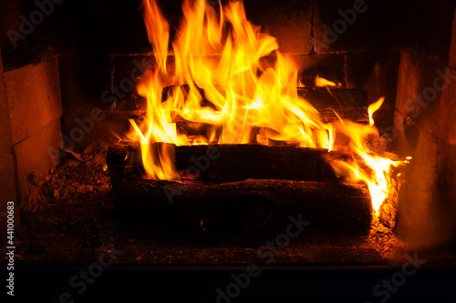 burning logs in the fire of a barbecue or stove or fireplace