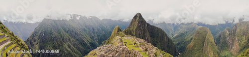 Panoramic view of Machu Picchu lost city with Huayna Picchu mountain. Ruins of ancient inca civilization in the sacred valley of Cusco Province. Peru, South America