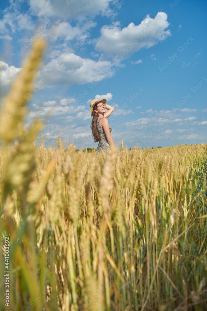 Young girl with long hair in a field