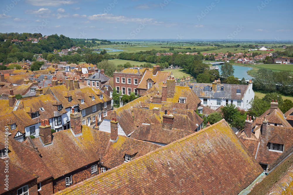 Rye, East Sussex, England, UK - June 13, 2021: Aerial view across rooftops of picturesque Cinque Port town, a popular travel destination in East Sussex.