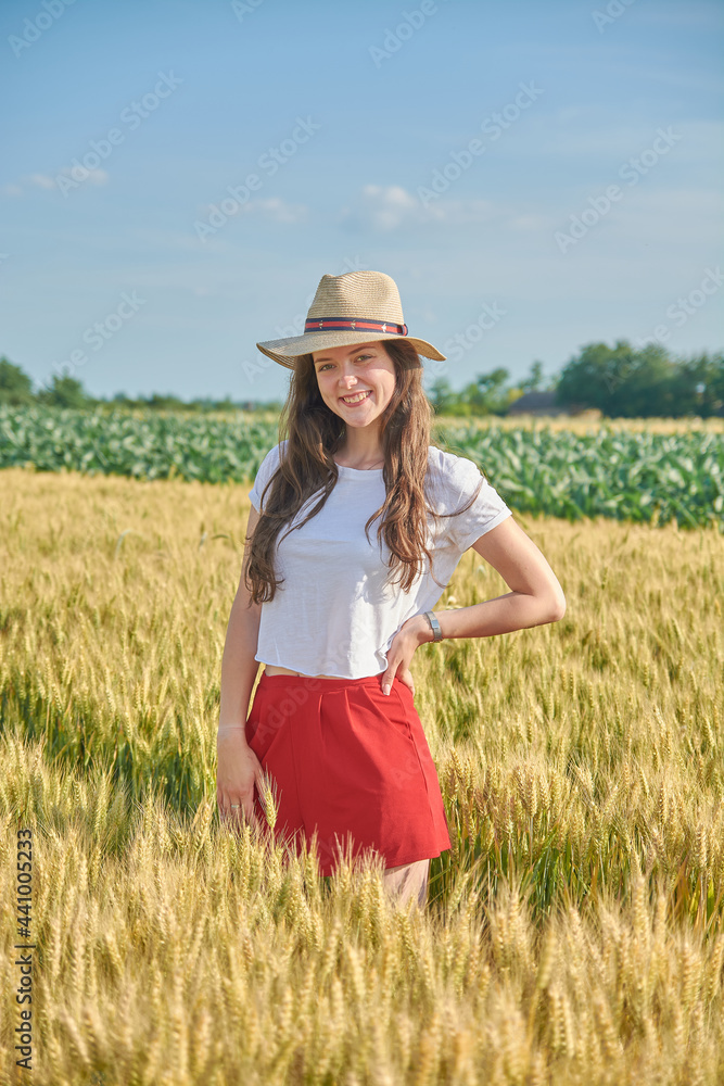 Young girl with long hair in a field
