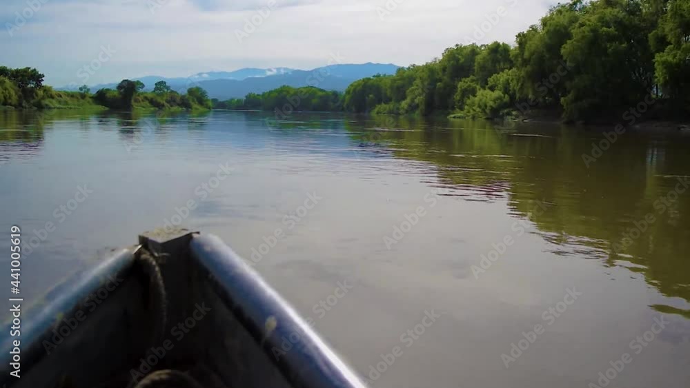 Boat sailing on a muddy river in Colombia Boat sailing on a muddy river in Colombia