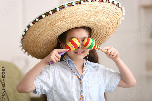 Cute Mexican girl in sombre...