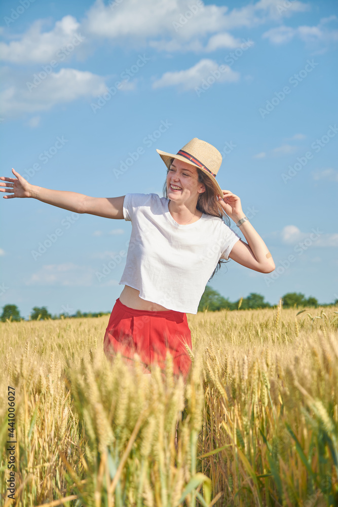 Young girl with long hair in a field