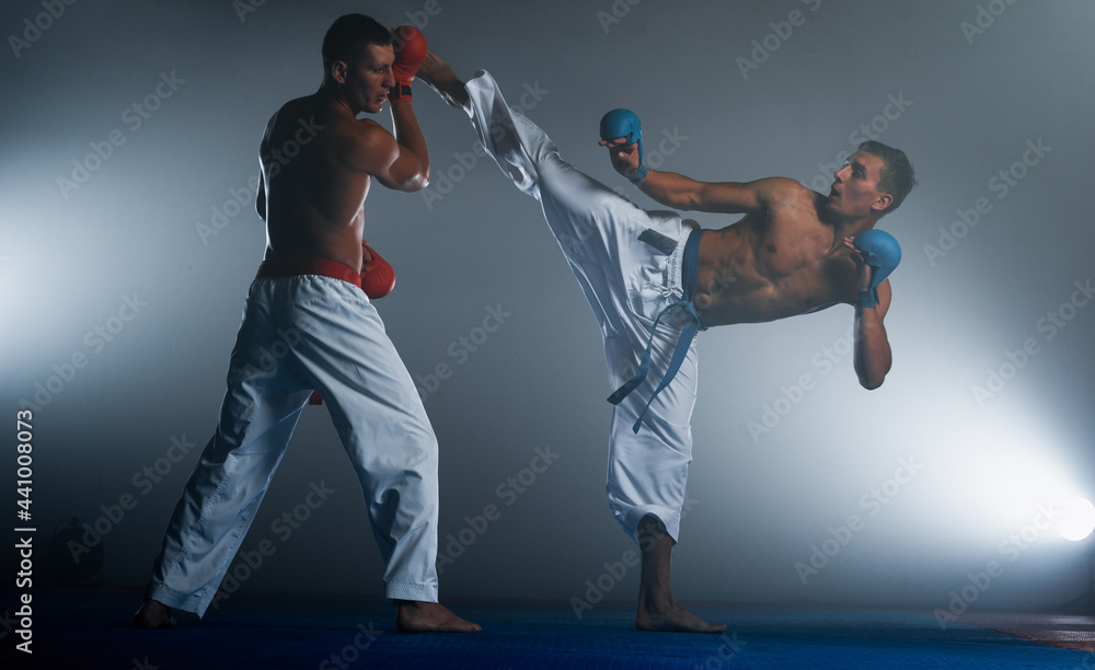Taekwondo action isolated by a young man Taekwondo action isolated by a young man