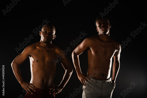 Two topless males