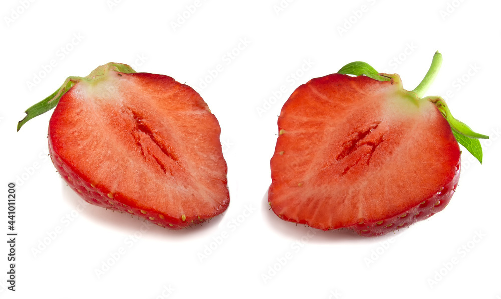 Two halves of strawberry isolated on white background. Red fresh berry in cut, full focus. Two halves of strawberry isolated on white background. Red fresh berry in cut, full focus.