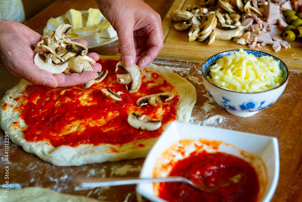 Fototapeta Preparing the Italian pizza