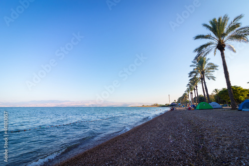 kineret-israel. 18-06-2021. Tents of hikers on the shores of the Sea of Galilee at sunrise, on Korsi beach photo