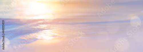 Abstract Bokeh sunset light background on peacful summer sea beach
