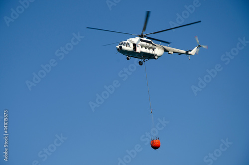 firefighter helicopter in the blue sky