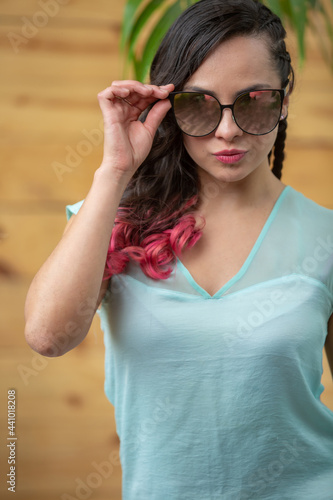 Mexican young woman summer portrait wearing sun glasses