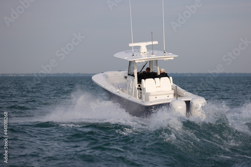 power boat cruising on a lake.