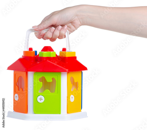 children's educational toy in hand on white background islolation photo