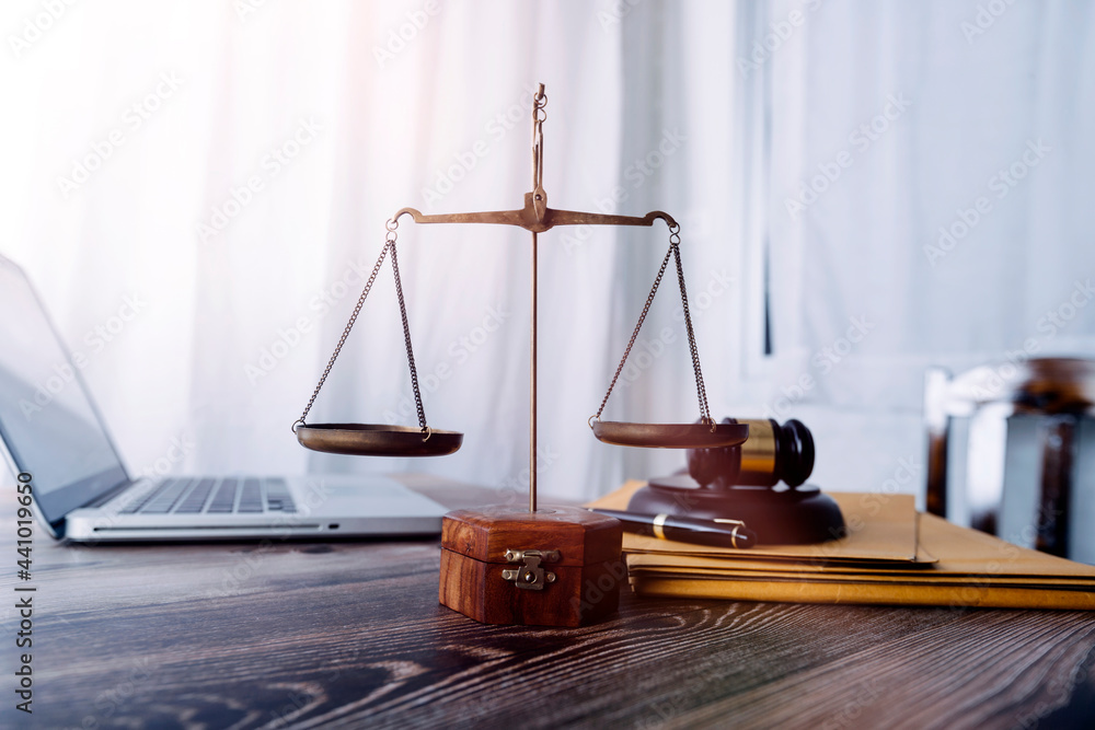justice and law concept.Male judge in a courtroom on wooden table and Counselor or Male lawyer working in office. Legal law, advice and justice concept. justice and law concept.Male judge in a courtroom on wooden table and Counselor or Male lawyer working in office. Legal law, advice and justice concept.
