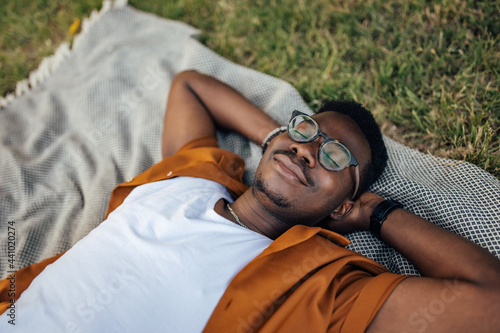 Foto Adult man, taking an afternoon nap, outside.