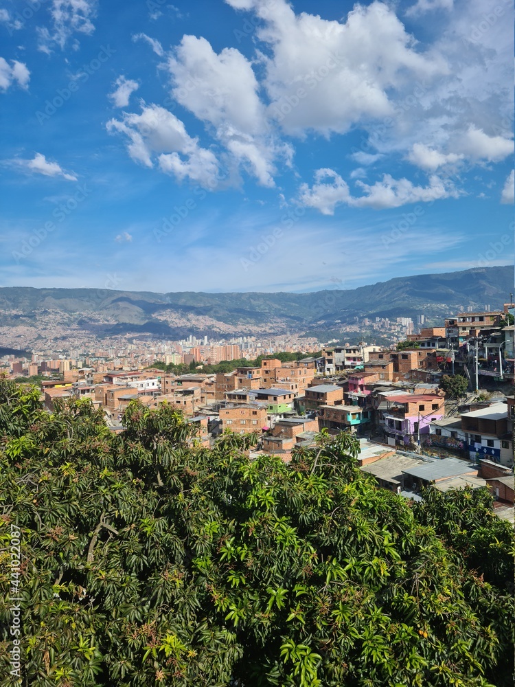 Cityscape with view of the commune 13 and blue sky. Medellin, Antioquia, Colombia.
