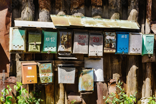 Old mailboxes in the courtyard of an apartment building. The picture was taken in Russia, in the city of Orenburg