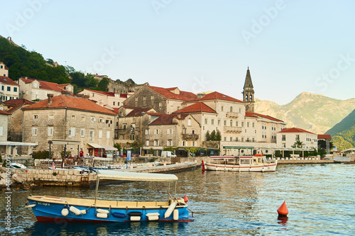 Historic city of Perast in the Bay of Kotor in summer at sunset