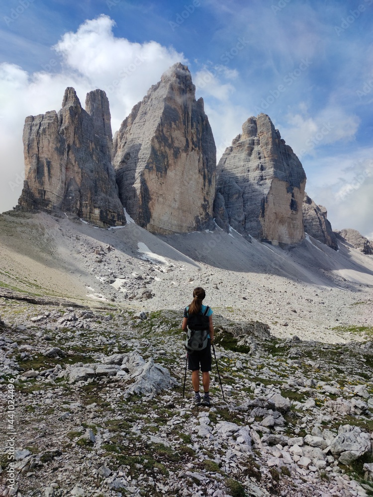 hiker in the mountains, the Dolomites, Italy, summer time