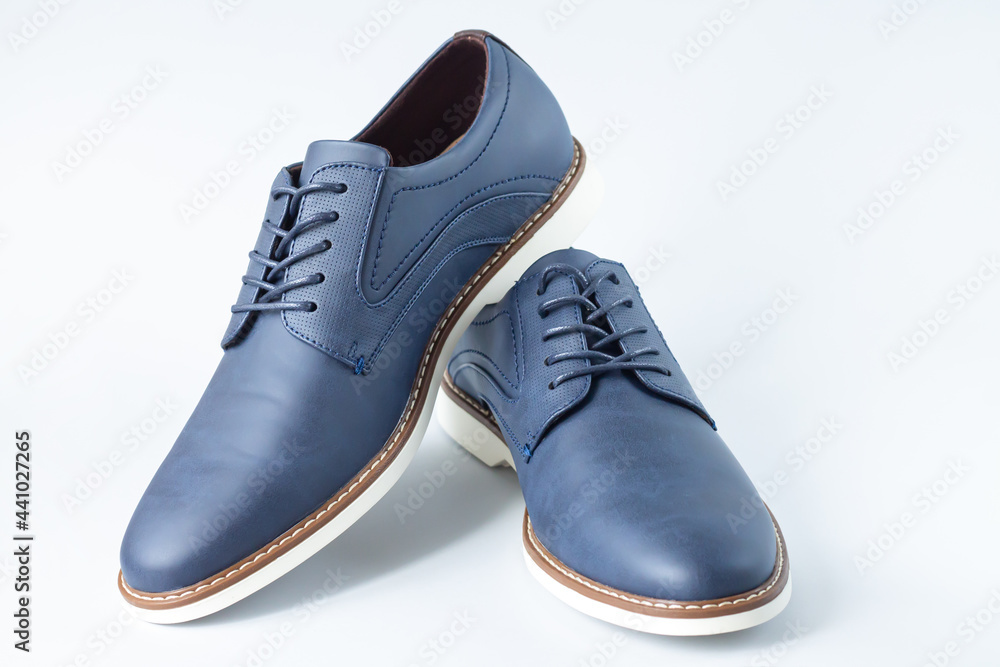 Classic men leather casual blue shoes on gray background