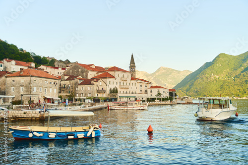 Historic city of Perast in the Bay of Kotor in summer at sunset