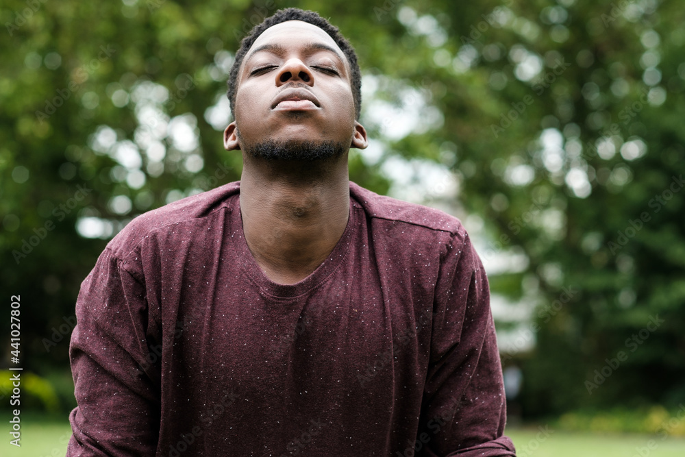 Young black man doing relaxation exercise. Young black man doing relaxation exercise.