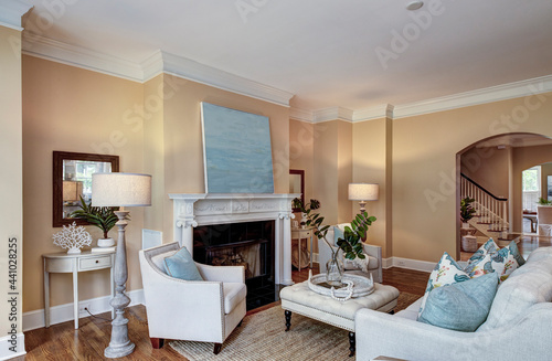 spacious livingroom with fireplace and tasteful furniture.