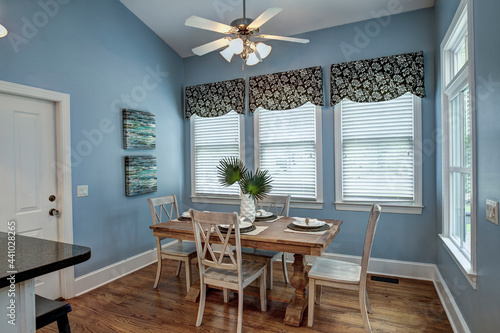 Elegant but simple diningroom with table and chairs. photo