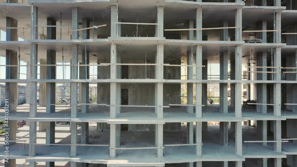Aerial view of high residential apartment building under construction. Real estate development. Aerial view of high residential apartment building under construction. Real estate development.