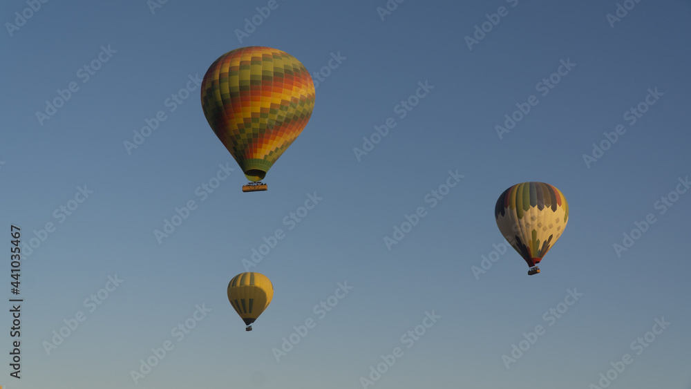 Hot air balloons floating in sky of Luxor, Egypt Hot air balloons floating in sky of Luxor, Egypt