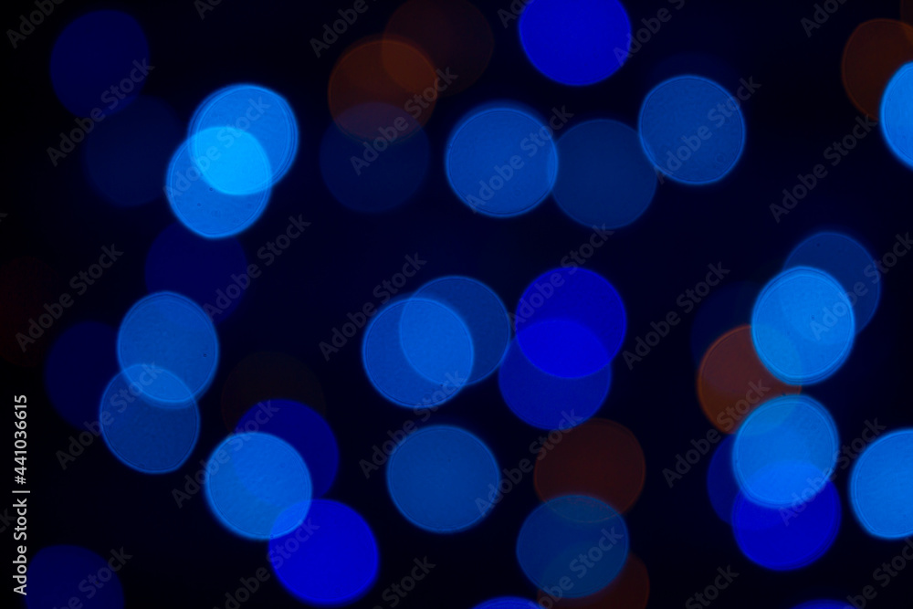 Blue bokeh on a black background. Abstract background Blue bokeh on a black background. Abstract background