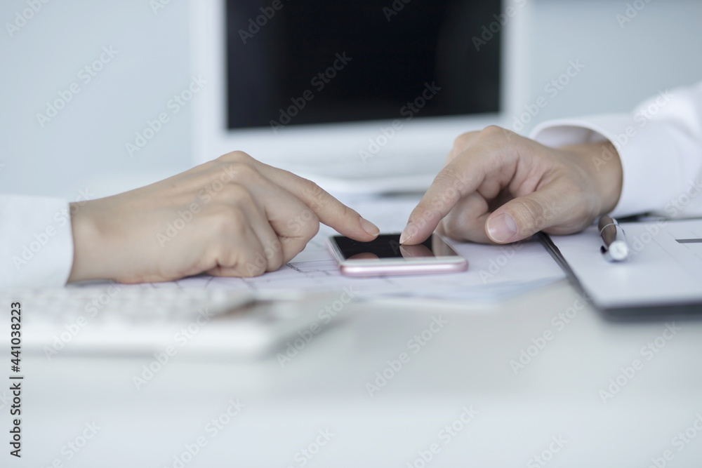 Business people using smartphone in meeting Business people using smartphone in meeting