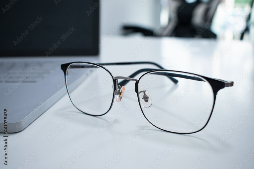 Glasses on the desk in an office. Glasses on the desk in an office.