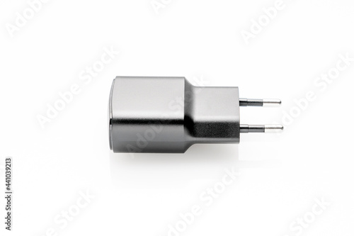 black plug of the USB adapter on a white background