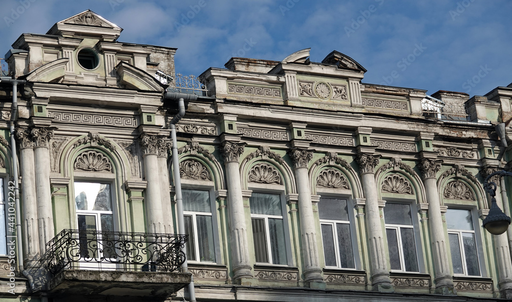 Facade of an old building with a balcony