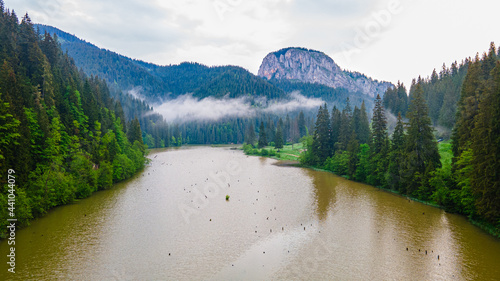 Aerial photography at Red lake in Romania, Neamt county. Landscape photography taken from a drone with view of a lake, camera angle is lowerd towards the ground. Birds eye view over mountain lake. photo
