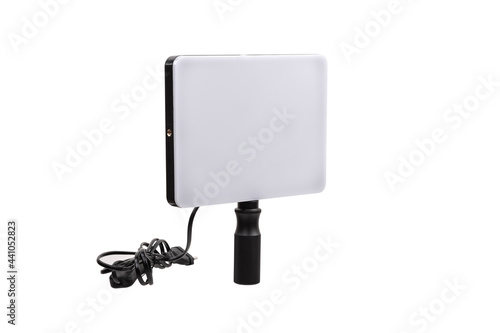 Professional lighting equipment for video production isolated on white. Portable video light for filming video and video blogging. Lighting device for film production.