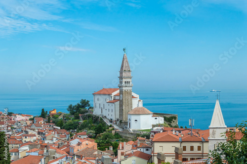 A panoramic of old town Piran, Slovenia. View over the tiled roofs of Piran and the Adriatic Sea.