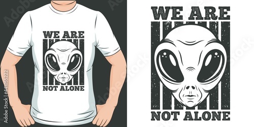This We Are Not Alone design is perfect for print and merchandising. You can print this design on a T-Shirt, Hoodie, Poster, Sticker and many more merchandising according to your needs.