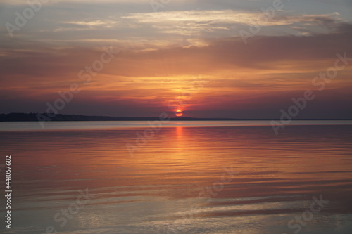 sunset at the beach. sunset in the sea. sunset over the sea. © Oksana