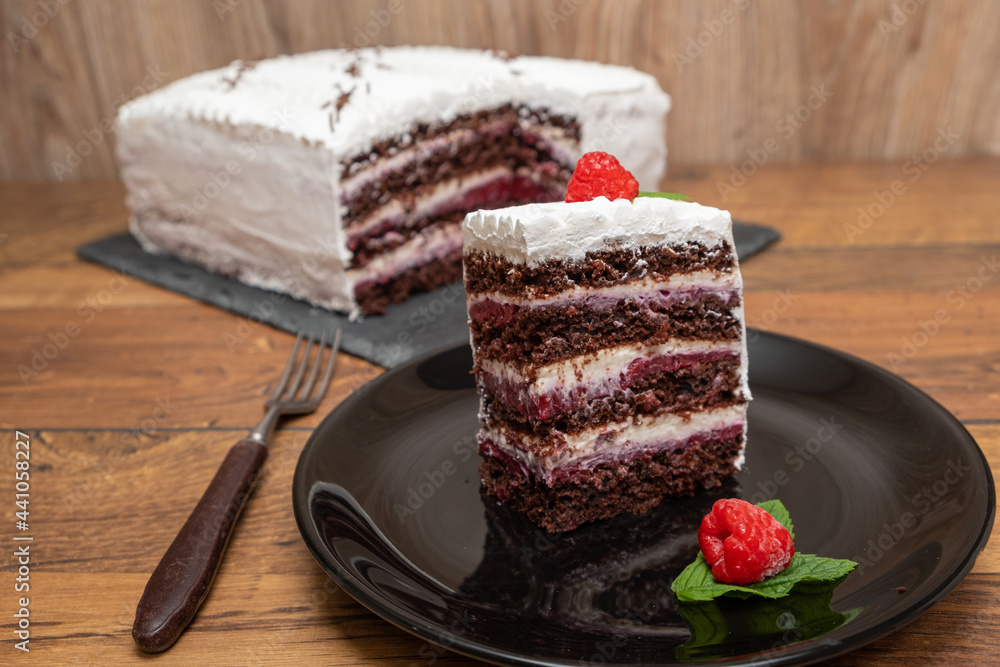 Chocolate raspberry cake with whipped cream filling