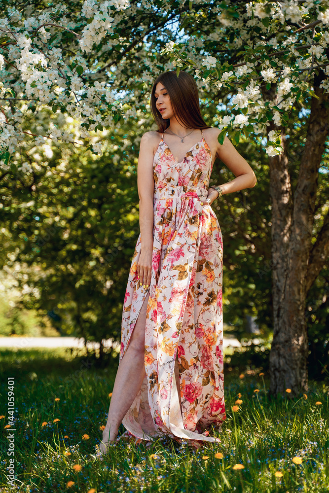 Portrait of a beautiful cute girl in blooming apple orchards Portrait of a beautiful cute girl in blooming apple orchards