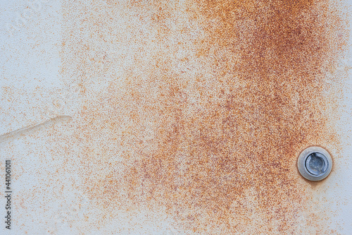 Rusted grey metal electrical box surface with key closure device in gray matte for texture and backgrounds design