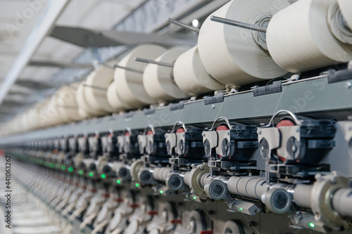 Textile factory. Coils with different windings on the production line