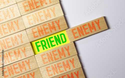 ENEMY word written on wood block, concept photo