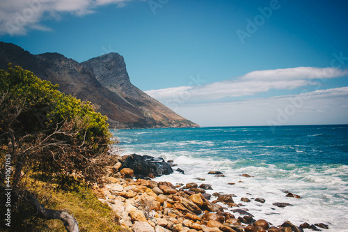 Beautiful shot of the Cape Peninsula shore in South Africa with Cape Point in the background