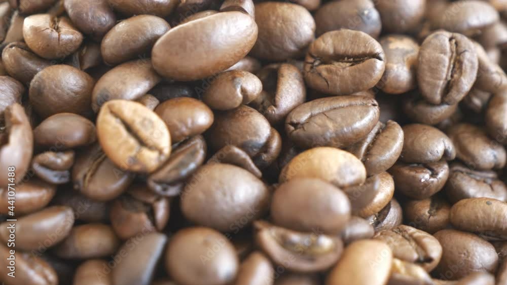 A close up view of fresh coffee beans. A close up view of fresh coffee beans.