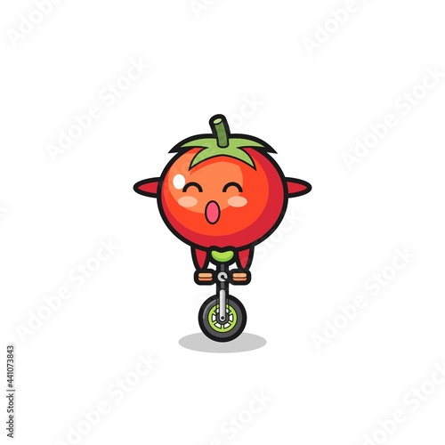 The cute tomatoes character is riding a circus bike