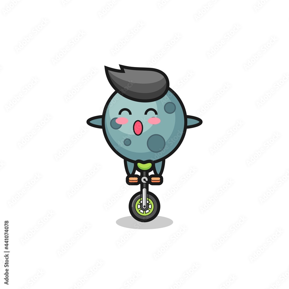 Fototapeta premium The cute asteroid character is riding a circus bike
